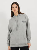 Women’s Longline Slogan Print Pullover Hoodie — Regular Fit with Kangaroo Pocket | DOCACCA Pakistan