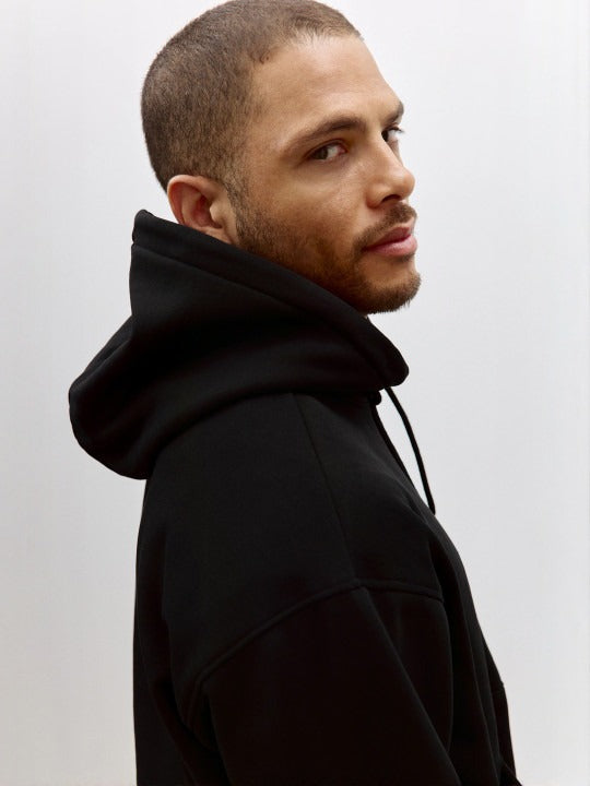 Men Black Relaxed Fit Hoodie – Comfortable Streetwear Style in Pakistan | HARCHIZ